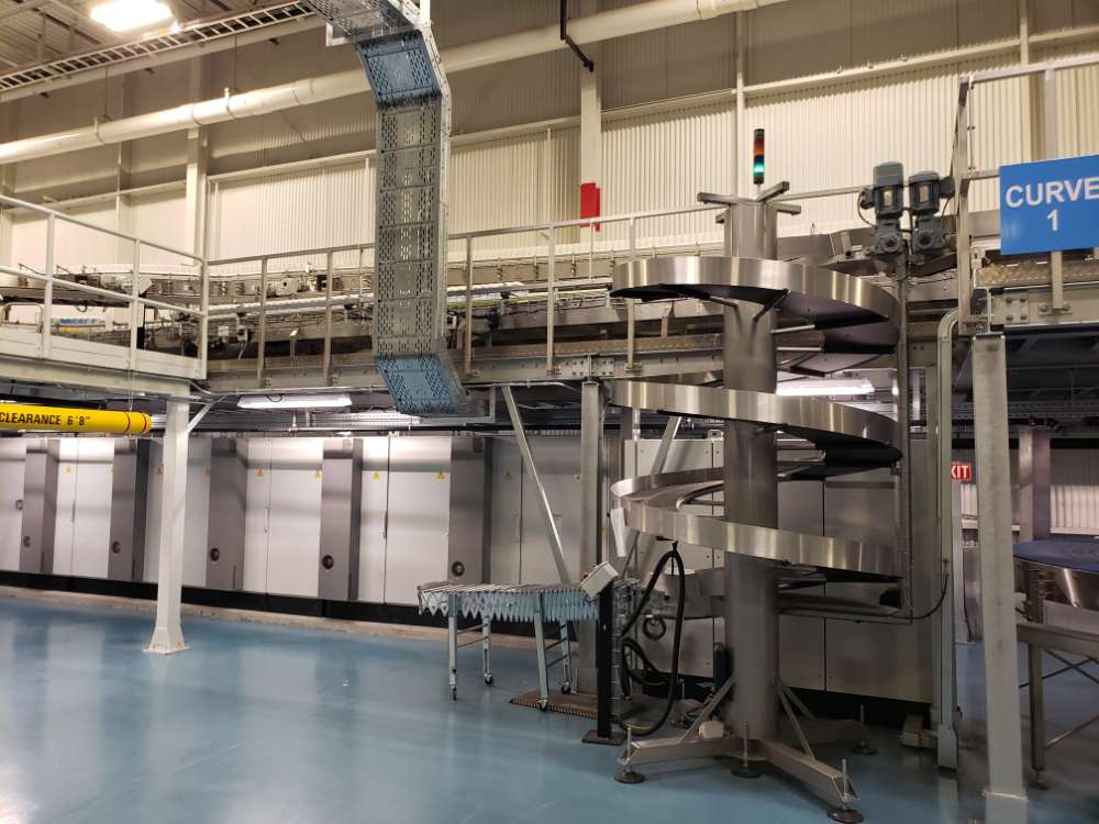 structural steel walkway with industrial machinery