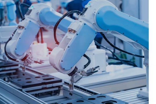 automation and robotics, robotic arms working on a production line