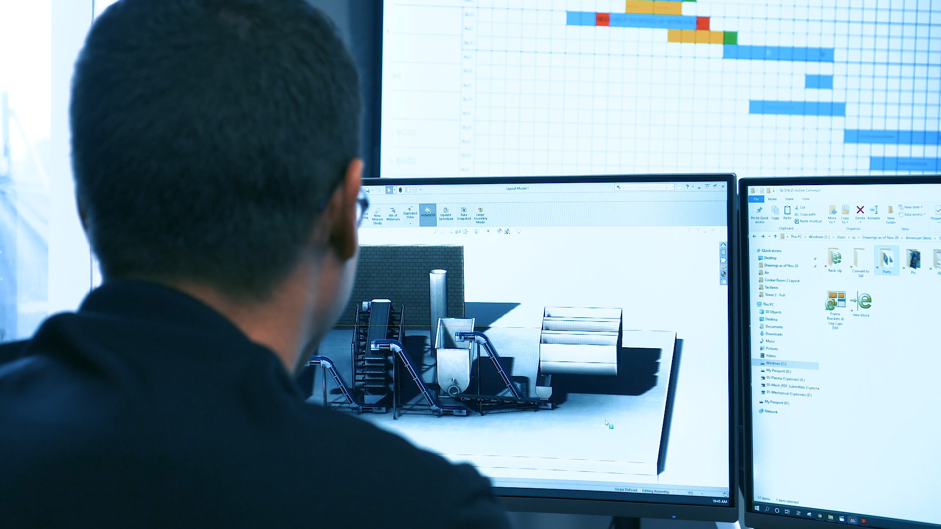 PEC specialist working at computer screen