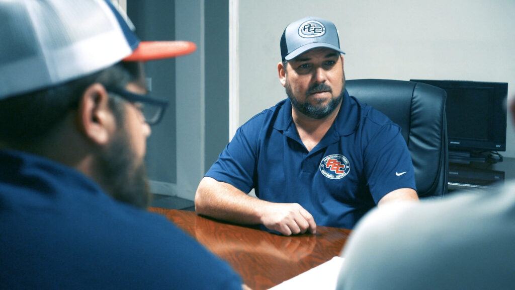 PEC team at conference table consulting on automated packaging systems