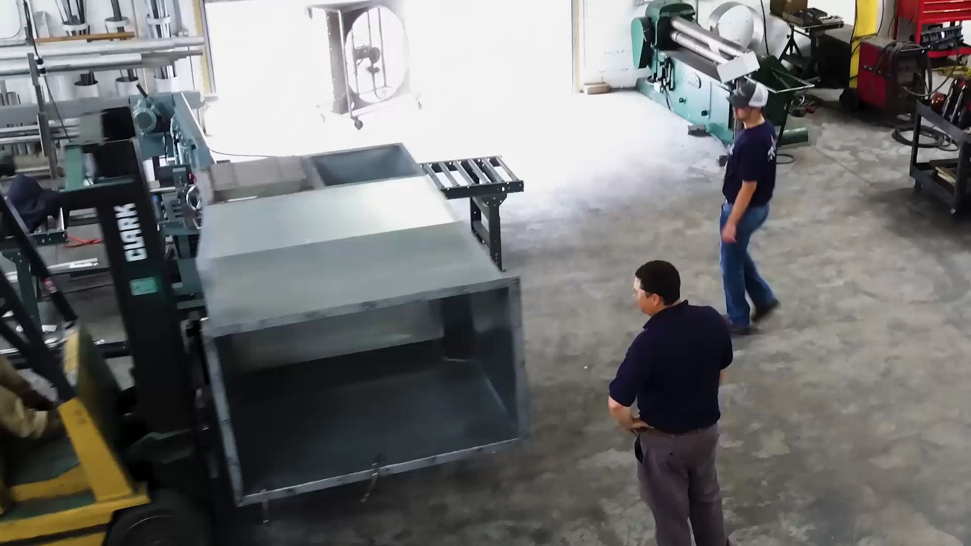 PEC employees observing industrial equipment