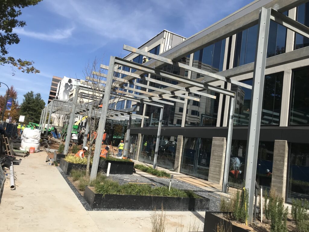 structural steel building with landscaping and canopies
