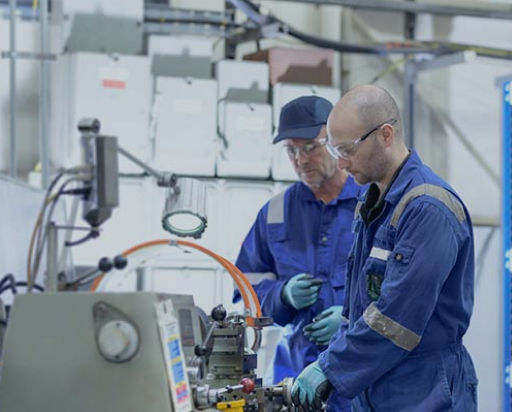 two PEC engineers work on System Upgrades