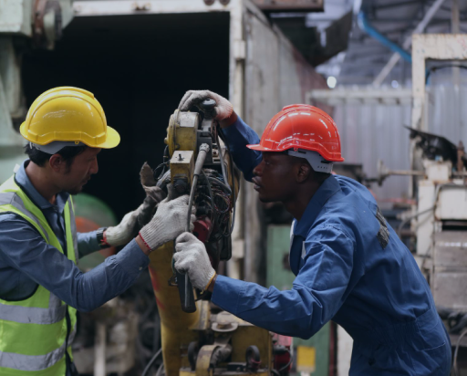PEC employees performing equipment maintenance services in an industrial setting